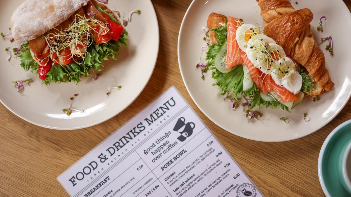 Tasty croissant sandwich with salmon and ciabatta with vegetables, perfect for a balanced meal.